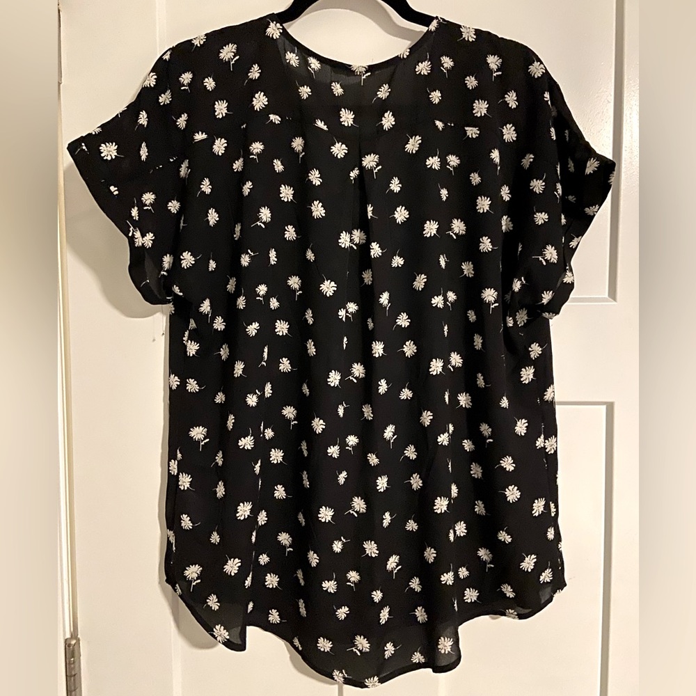 MAURICES-Size XL--Women’s black floral blouse with cut-out neck design.